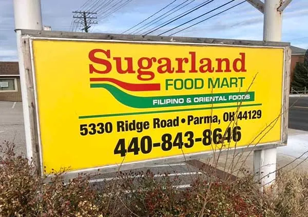 Sugarland Food Mart storefront sign